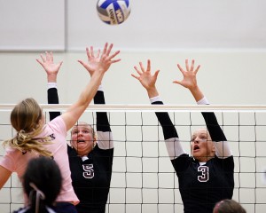 Augsburg volleyball players Korri Yule (5) and Katie Christensen.