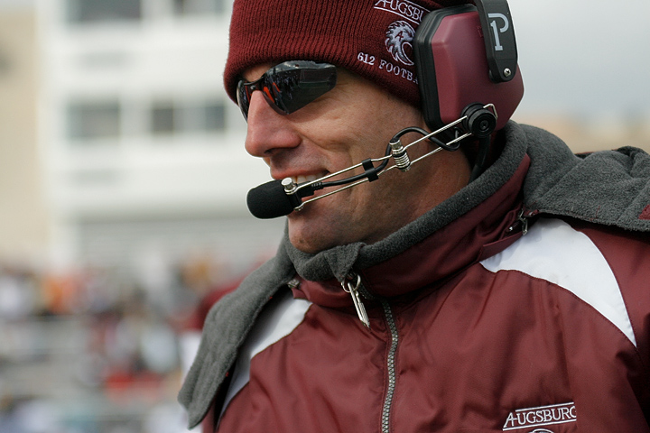 Augsburg head football coach Frank Haege smiles after Augsburg makes a defense stop in the fourth quarter of a game between Augsburg College and Carleton College on October 10, 2009 in Minneapolis, Minn. Haege's team won 31-28 and had 510 yards of total offense. In his fifth season, Haege has a record of 14-31.