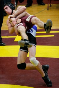 Michael deJolsvay (Hopkins HS) throws Northfield's Luke Schwalbe during a match at Northfield HS in Northfield, Minn. deJolsvay won the match by pin at 4:14. Northfield won the dual by a score of 60-15.