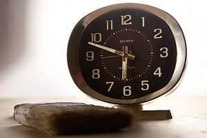 A clock and a paint brush.