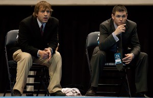 Augsburg assistant coach Brad Fisher (left) and head coach Mark Matzek watch the action between Paul Bjorkstrand (Augsburg) and Bebeto Yewah (Wisconsin-La Crosse), not pictured, in the 133 pound final of the 2010 NCAA Division III Wrestling National Championships in Cedar Rapids, Iowa on March 6. Yewah won the match 14-9. Augsburg won the team title for the 11th time in 20 years.