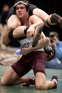 Zach Molitor wrestles for control with Ohio Northern's Kyle Kwiat in the 174-pound third-place match at the 2010 NCAA Division III Wrestling Championships on March 6, in Cedar Rapids, Iowa. Molitor won the match 5-1, earning his second All-American honors in two years with the program.