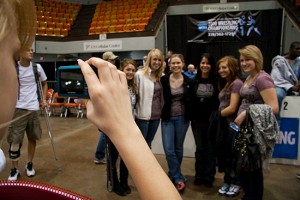 100306-Post-Session-4-362 Student manager Kristina Nelson takes a picture of her fellow student managers (from left), Morriah Kovar, Karly Lungstrom, Claire Elizabeth, Jackie Fritz, Kori Osina and Sally Jane Wattrus at the 2010 NCAA Div. III Wrestling National Championships in Cedar Rapids, Iowa on March 6, 2010