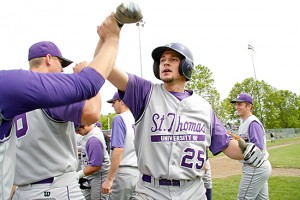 Tom Whippler (25) celebrates with teammates after hitting the first of three home runs on the day -- this one a game-winning two-run shot in the first game -- during a 7-6 11-inning win over Concordia-Moorhead in the final elimination round game of the MIAC baseball tournament on May 15, 2010 in Dundas, Minn. St. Thomas advanced to face Augsburg in the championship round. The Auggies won a 3-2 game the previous day, but St. Thomas crushed the Auggies 17-1.