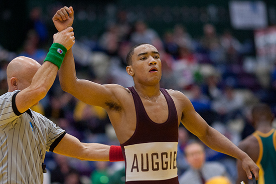 2013 125 pound All American Mike Fuenffiger of Augsburg has his hand raised after defeating Brockport State's Matthias Ellis II in the 7th Place Match at the 2013 Division III National Championship.