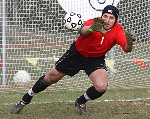 NORTHFIELD, MINN. -- Carleton's goalkeeper James Neher makes one of his three saves during the first half of an MIAC men's soccer semifinal against St. Olaf. Carleton defeated the Oles 1-0.