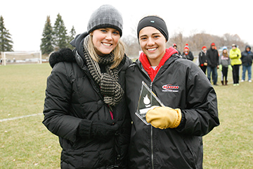 COLLEGEVILLE, MINN. -- St. Benedict sophomore forward Elite 22 award winner Piper Murray poses with MIAC Assistant Director Megan Gaard following  a 3-2 victory over Macalester in the MIAC women's soccer playoff final at St. John's Univ. (Minn.) Hawes Field, Nov. 9, 2013. Murray has a 4.0 GPA as a Integrated Health Science/Pre-Physical Therapy major.