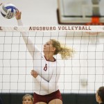 Augsburg volleyball player Jessica Lillquist (8) goes up for shot against UW-Stout's Ashley Pratt (14) n the first set of a match between UW-Stout on September 11, 2014. Augsburg won 3-2 (25-12, 15-25, 25-18, 18-25, 15-9).