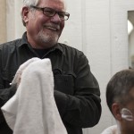 Craig Martin shares a laugh with a client at Mug & Brush Hair Design in South Minneapolis, Minn. on January 3, 2012.