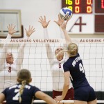 Augsburg volleyball players Jessica Lillquist (8) and Colleen Ourada (6) go up for a block in the first set of a match between UW-Stout on September 11, 2014. Augsburg won 3-2 (25-12, 15-25, 25-18, 18-25, 15-9).