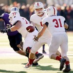 ST. PAUL, MINN. (Nov. 28, 2015) -- St. John's senior quarterback Nick Martin (5) hands the ball off to senior running back Sam Sura (31) during the third quarter of an NCAA Div. III Football second round playoff game at the University of St. Thomas in St. Paul, Minn. The No. 4 Tommies defeated their arch-rival No. 10 Johnnies 38-19. Sura rushed for 54 yards and a touchdown in his final collegiate game.